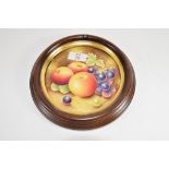 Royal Worcester type circular plaque painted with fruit, bearing signature by Leaman, the plaque
