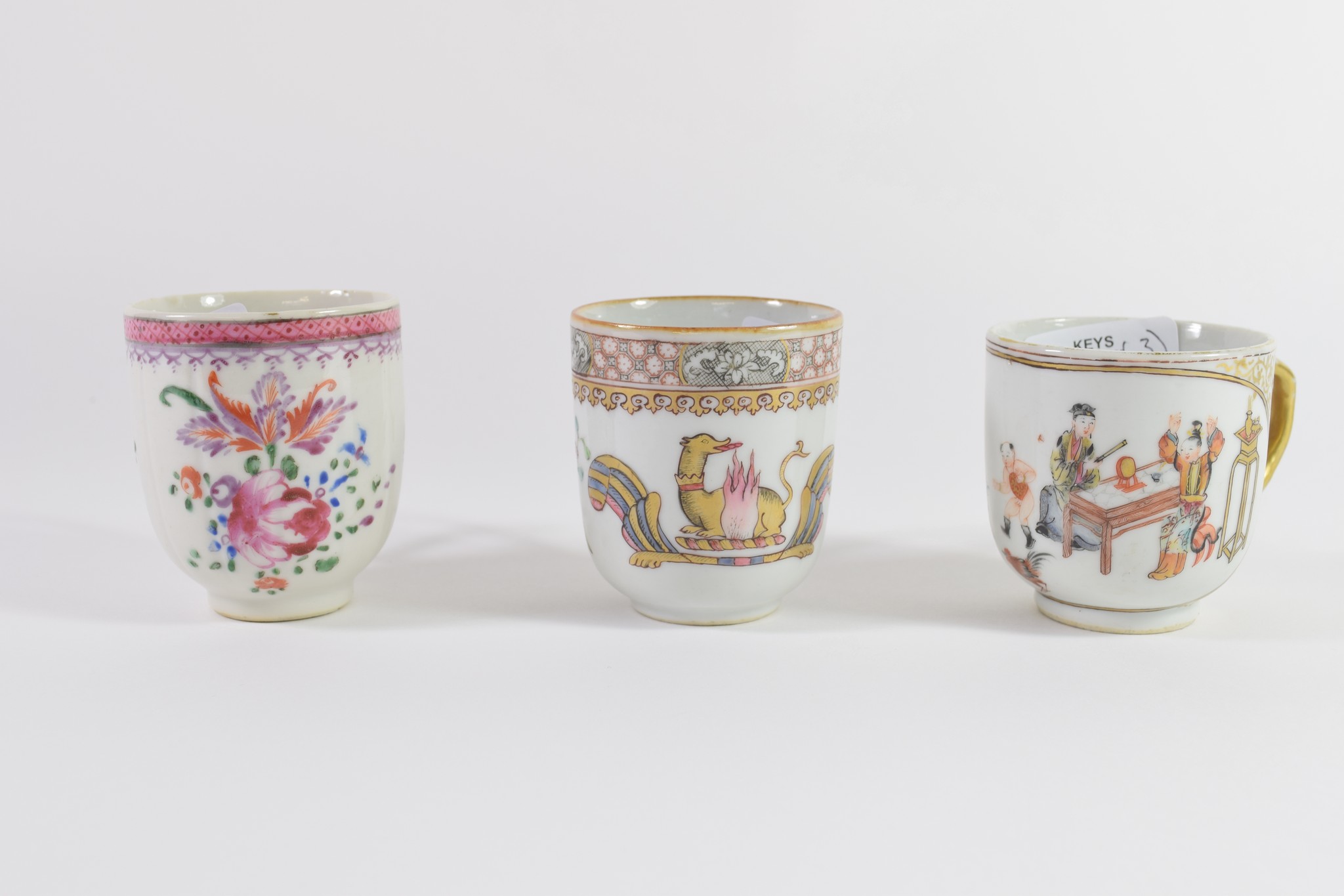 Group of three 18th century Chinese porcelain coffee cups, all with polychrome and gilt