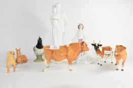 Group of Beswick wares including three bulls and calf, figure of a lapwing and Royal Doulton figures