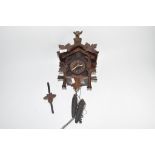 Early 20th century Black Forest cuckoo clock, case height max 31cm, typical decoration mounted