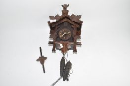 Early 20th century Black Forest cuckoo clock, case height max 31cm, typical decoration mounted