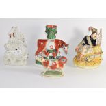 Group of Staffordshire figures including one of a soldier, group of cow and calf and a creamer (4)