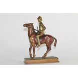 Vintage spelter figure of a mounted female polo player, 19cm high
