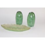 Pair of Nailsea type green paperweights together with a further green glass dish (3)