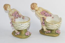 Pair of Austrian amphora figures of children holding baskets, one with restoration (2)