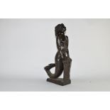 20th century bronzed composition model of a mermaid leaning on a rock, 45cm high