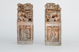 Pair of metal models of Oriental characters with dog of Fo or lions above