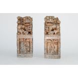 Pair of metal models of Oriental characters with dog of Fo or lions above