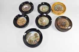 Group of seven Pratt ware lids in wooden frames including The Enthusiast, On Guard and views of
