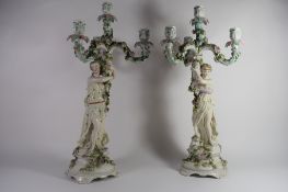 Pair of late 19th century Sitzendorf candelabra, both modelled as maidens supporting a central