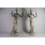 Pair of late 19th century Sitzendorf candelabra, both modelled as maidens supporting a central