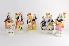 Group of five Staffordshire spill holder figures mainly in Highland dress (5)