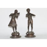 Pair of bronzed figures of boy and girl musicians (2)