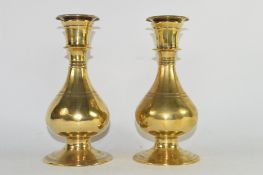 Two brass baluster shaped candlesticks