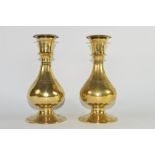 Two brass baluster shaped candlesticks