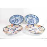 Pair of Japanese Imari style dishes and two further Japanese blue and white decorated dishes (4)