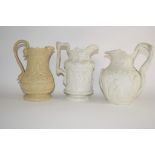 Group of three 19th century relief decorated pottery jugs, one by Charles Meigh, with a Bacchanalian