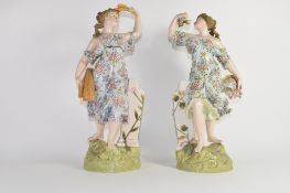 Pair of Continental porcelain figures, probably Sitzendorf, decorated in Meissen style, both figures