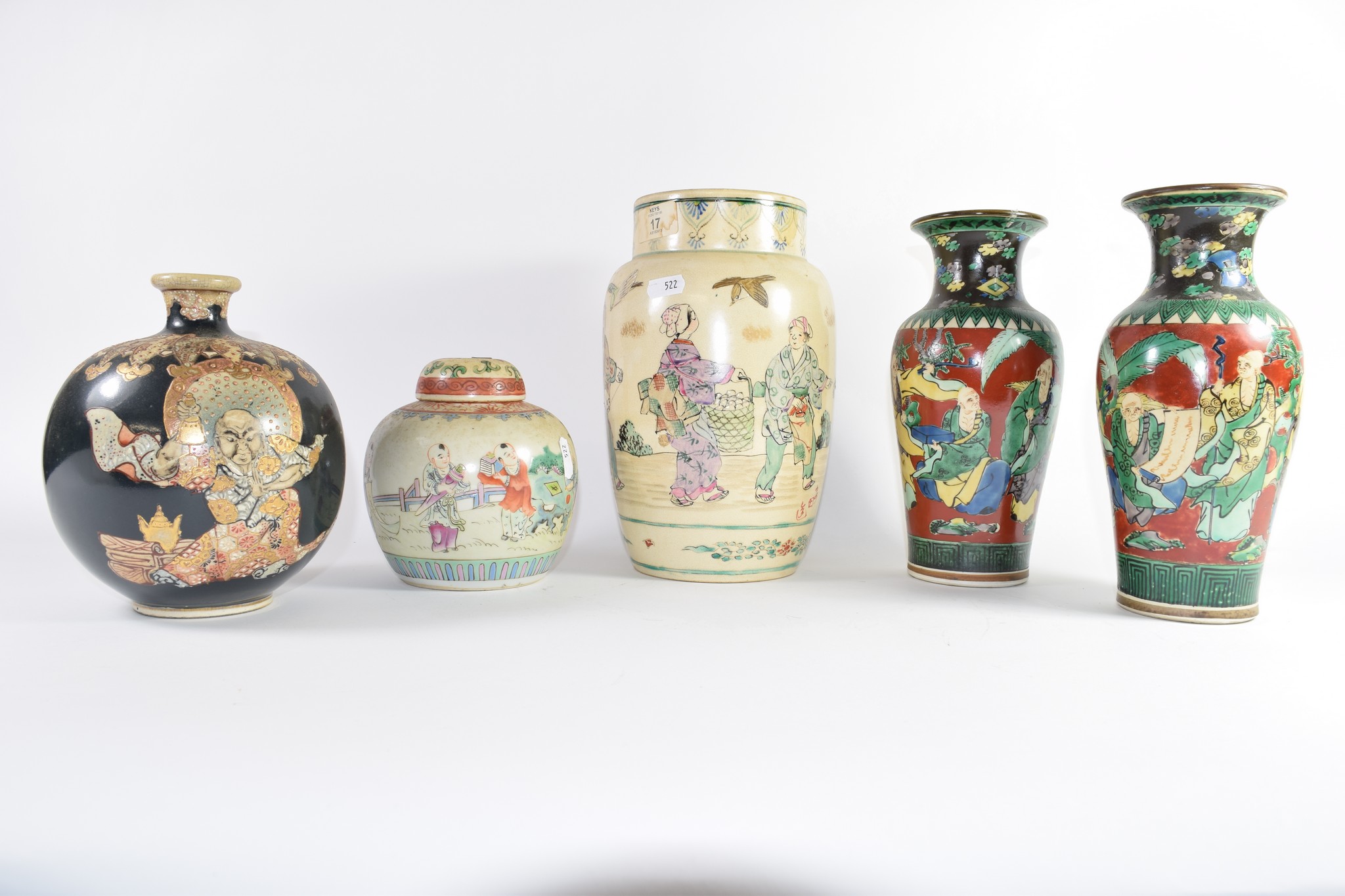 Group of Oriental pottery wares including a large vase with figures, further pair of vases with