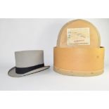 Grey coloured top hat in box by Moss Bros