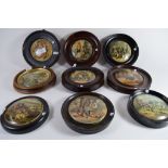 Group of nine pot lids in wooden frames, various scenes including Dr Johnson, views of country