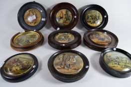 Group of nine pot lids in wooden frames, various scenes including Dr Johnson, views of country