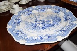 Large mid-19th century platter with a flow blue design, the reverse with Italian flower garden in