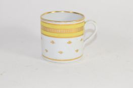 Coalport style coffee can with a yellow and gilt design, height 6cm high