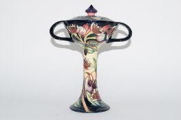 Modern Moorcroft vase and cover in Art Nouveau shape, decorated with tube lined flowers, the base