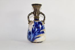 Doulton Burslem vase, late 19th century, the gilt ground with a blue floral design with loop