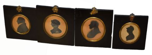 Group of four 19th century silhouettes, two male and two female profiles, assorted sizes (4)