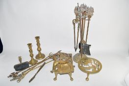 QUANTITY OF BRASS WARES INCLUDING FIRESIDE IMPLEMENTS AND TRIVETS