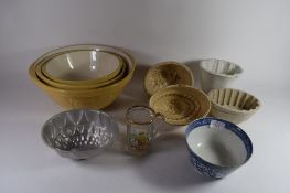 BOX CONTAINING JELLY MOULDS AND POTTERY DISHES