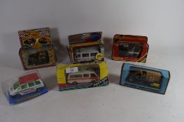 BOX CONTAINING DAYS GONE BY MODELS OF AMBULANCES