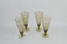 FOUR ENGRAVED WINE FLUTES