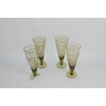 FOUR ENGRAVED WINE FLUTES