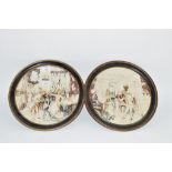 PAIR OF CONTINENTAL POTTERY WALL PLAQUES, RELIEF DECORATED WITH CLASSICAL FIGURES