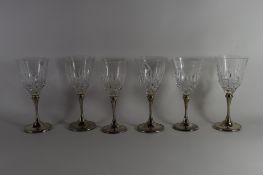 SET OF SIX CUT GLASS WINE GLASSES WITH SILVER COLOURED METAL STEMS
