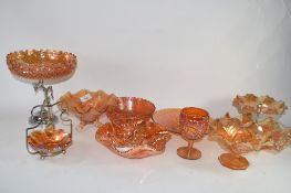 MANDARIN COLOURED CARNIVAL GLASS WARES INCLUDING A PEACOCK PLATE, STAR SHAPED BOWL, A FRUIT AND