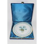 CASED PLATE WITH PRINCE OF WALES FEATHERS MADE BY ROYAL DOULTON, THE REVERSE WITH INSCRIPTION "