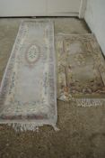 TWO MODERN CUT WOOL FLORAL RUGS, EACH APPROX 140 X 75CM