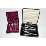 BOX OF SILVER PLATED TEA SPOONS TOGETHER WITH BOX CONTAINING SILVER METAL NUTCRACKERS AND GRAPE