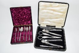 BOX OF SILVER PLATED TEA SPOONS TOGETHER WITH BOX CONTAINING SILVER METAL NUTCRACKERS AND GRAPE