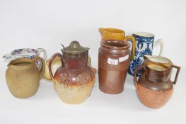 POTTERY JUGS INCLUDING TWO DOULTON HARVESTWARE JUGS, ONE WITH PLATED RIM AND COVER