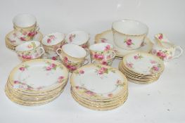 PART TEA SET BY ROYAL DOULTON WITH A FLORAL DESIGN COMPRISING TWELVE CUPS, SAUCERS, MILK JUG, SIDE