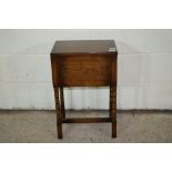 SMALL OAK SEWING BOX RAISED ON TURNED JOINTED LEGS, WIDTH APPROX 40CM
