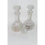 TWO TALL CUT GLASS DECANTERS AND STOPPERS, TOGETHER WITH A CUT GLASS BELL