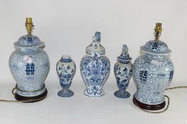 BLUE AND WHITE POTTERY WARES INCLUDING TWO CHINESE POTTERY VASES AND COVERS CONVERTED TO LAMPS AND A