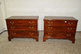 PAIR OF LOW REPRODUCTION MAHOGANY CHESTS OF DRAWERS, EACH WITH BRASS HANDLES AND CROSS-BANDED