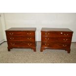 PAIR OF LOW REPRODUCTION MAHOGANY CHESTS OF DRAWERS, EACH WITH BRASS HANDLES AND CROSS-BANDED